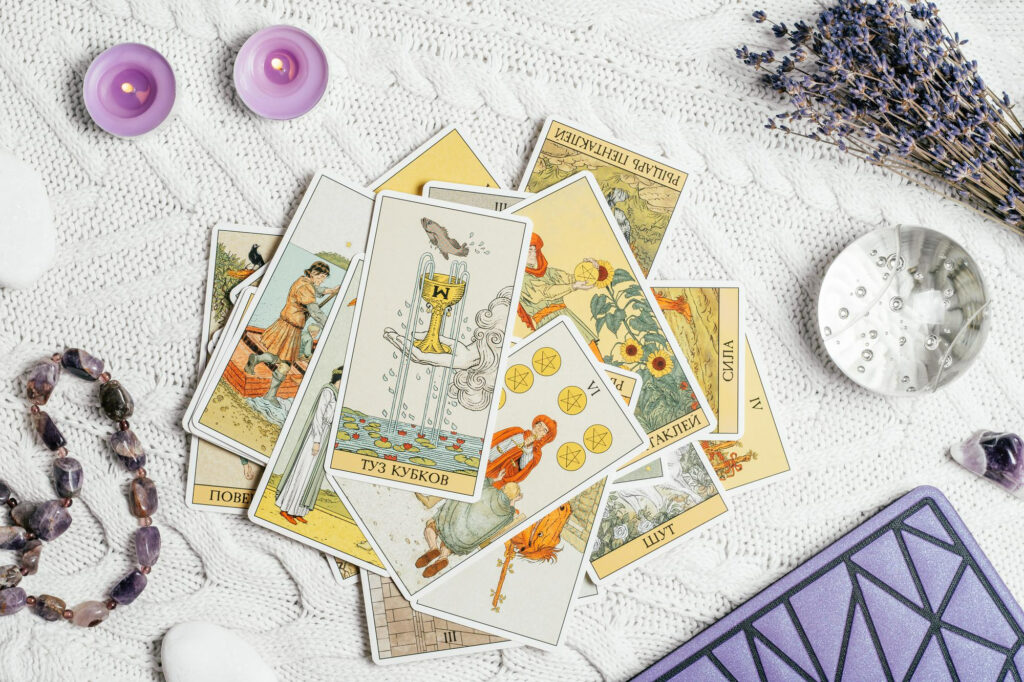 tarot cards spread face up white knitted surface with crystal ball lavender candles minsk belarus 11 10 2021